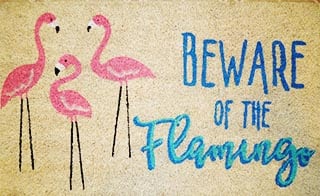 beware of the flamingo door mat