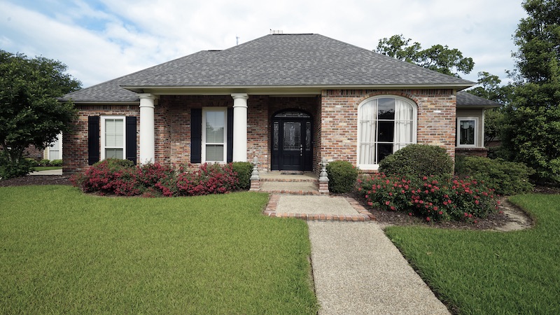 brick house with vinyl replacement windows