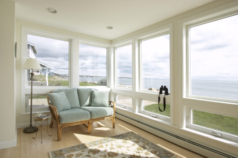 Replacement awning windows from Window World in sun room overlooking water.